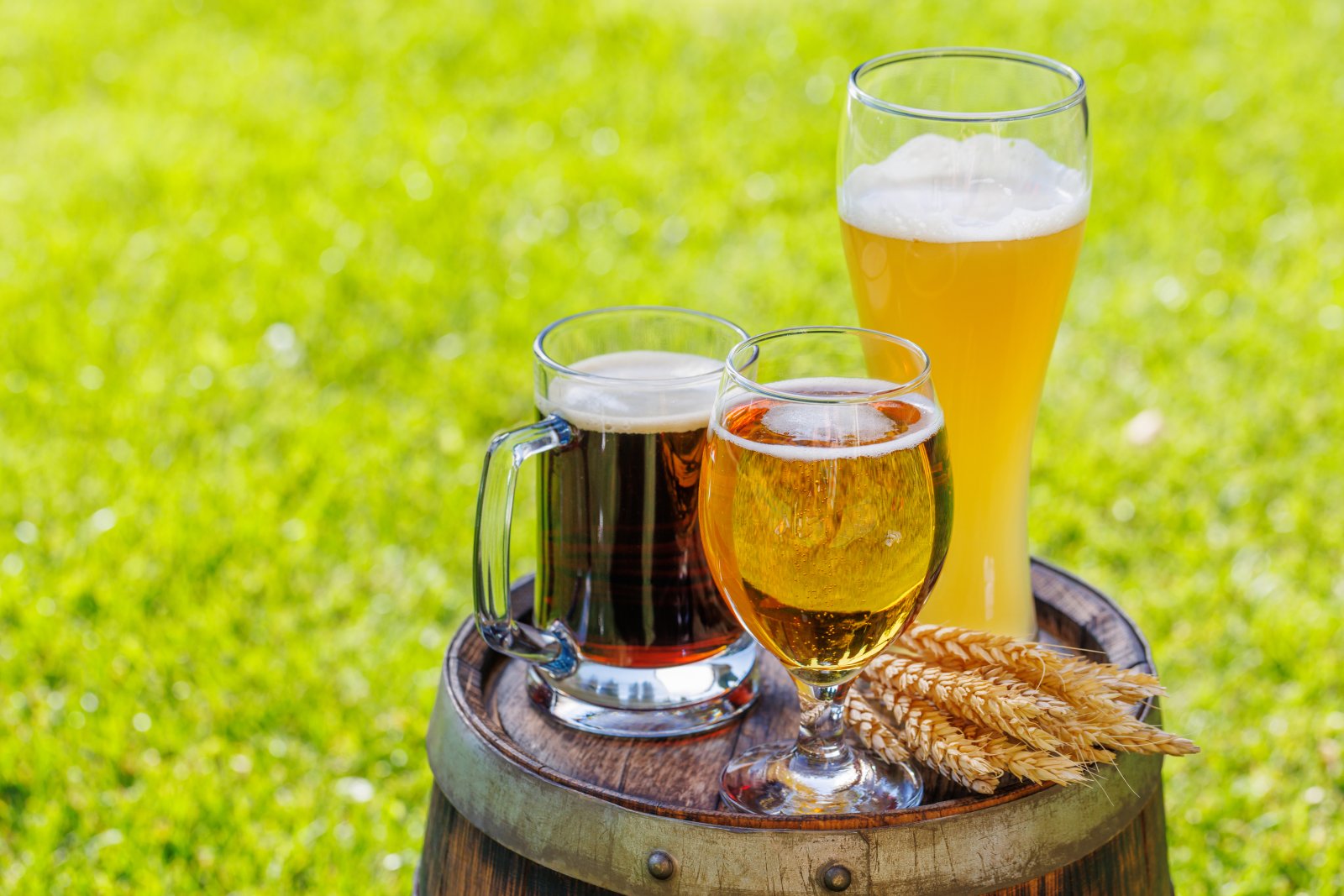 variety of beer glasses on rustic wooden barrel 2024 02 04 02 31 48 utc